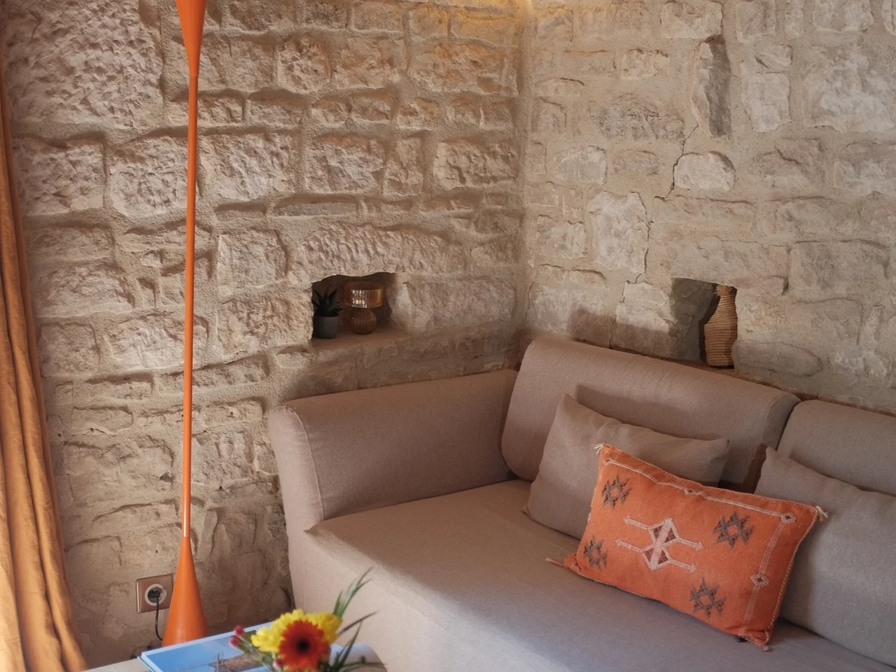Linen sofa and orange floor lamp in the upstairs sitting corner