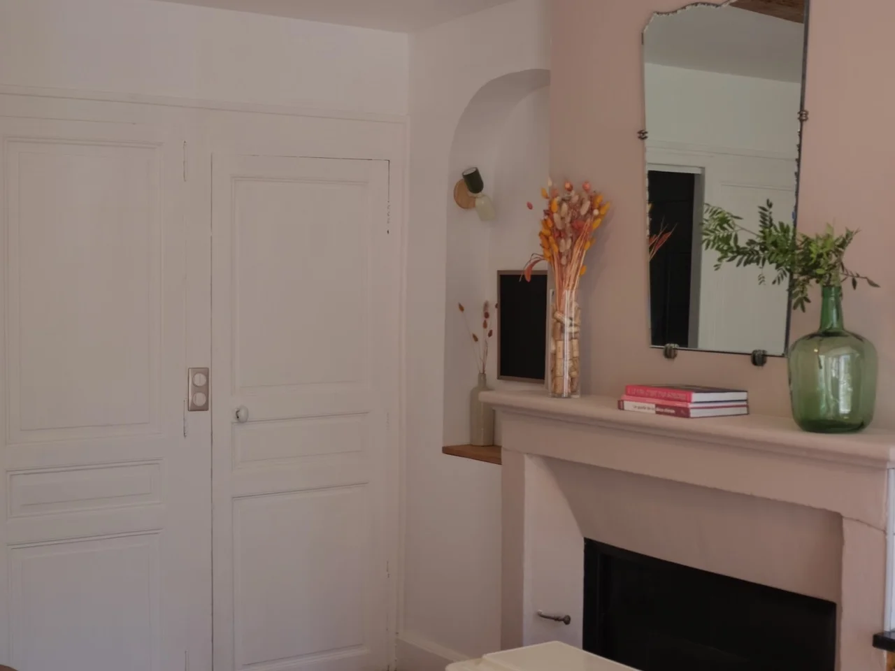 Blush living room with original fireplace and cream wood-burning stove