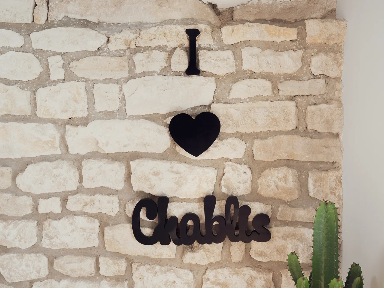 I love Chablis sign on stone wall
