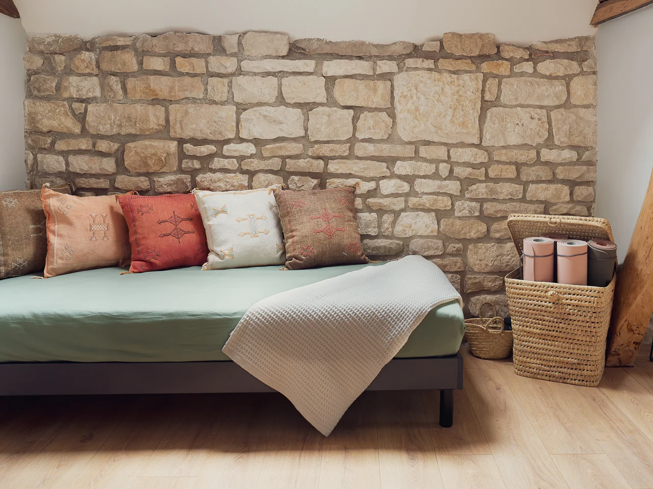 Daybed with yoga mats and indoor plants