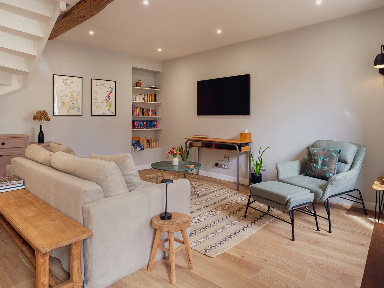 Living room with linen sofa and exposed beams