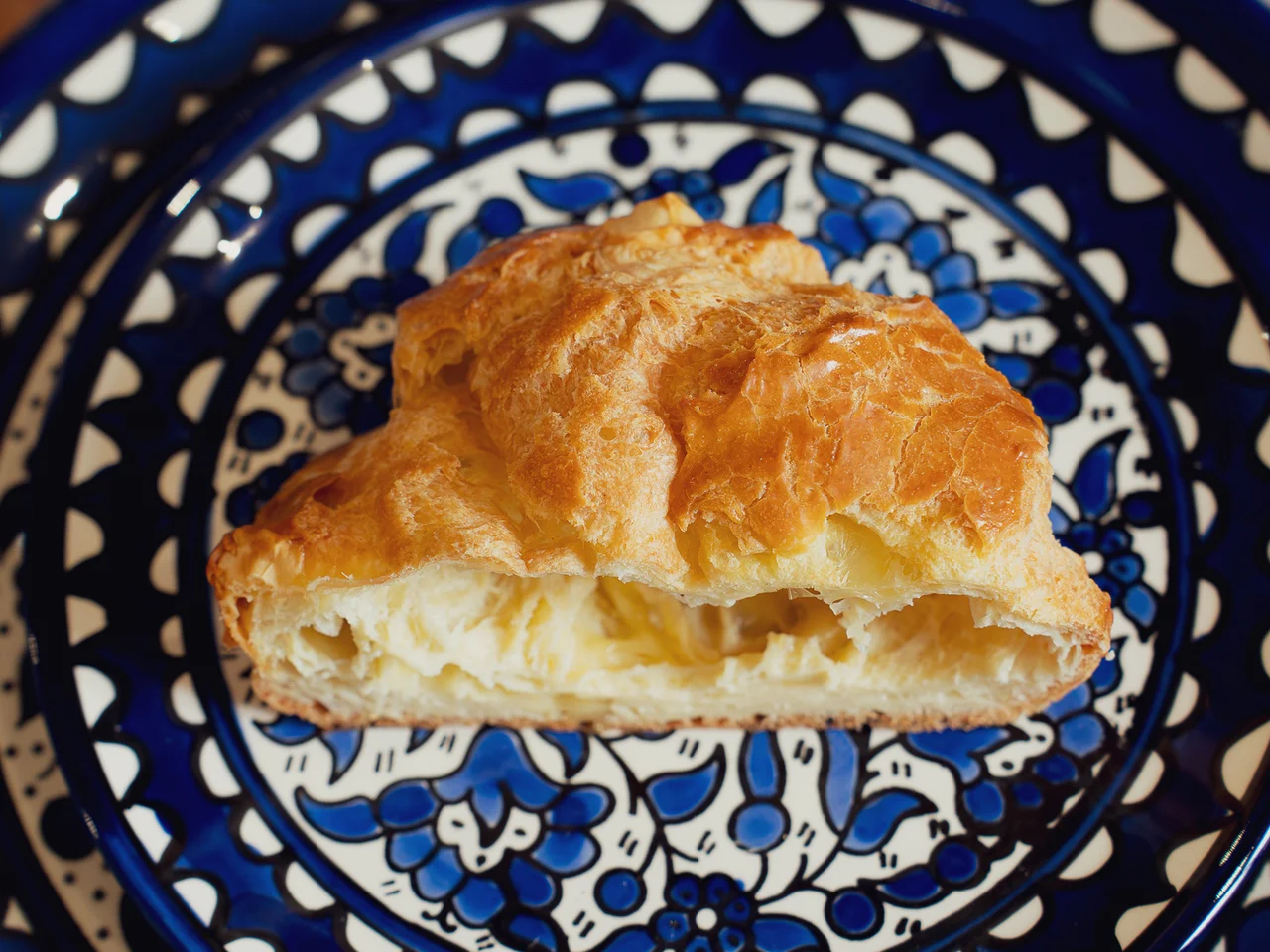 Pastry on hand-painted blue ceramic plate