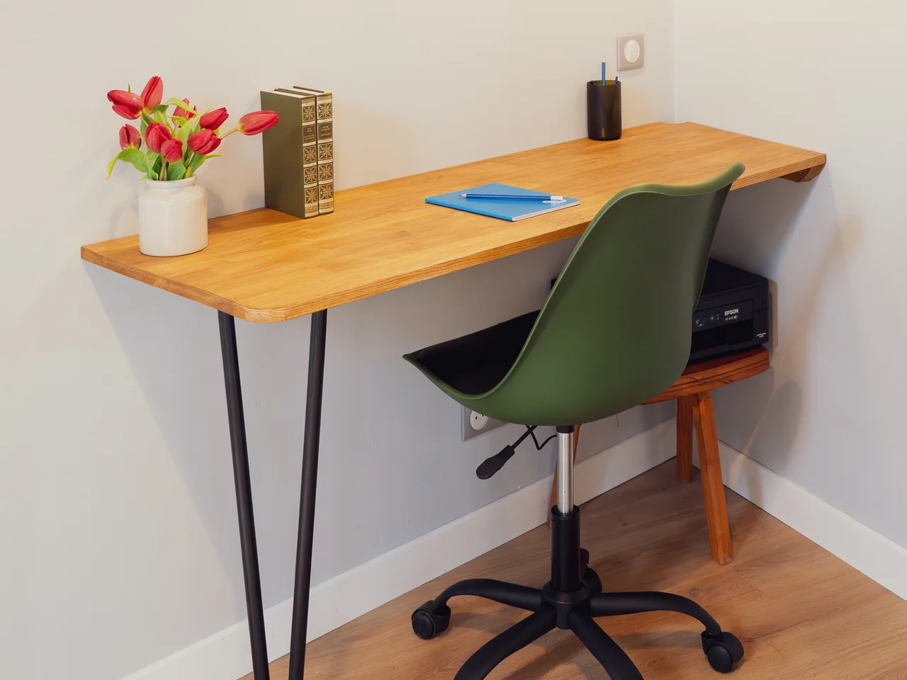 Desk with tulips and green office chair