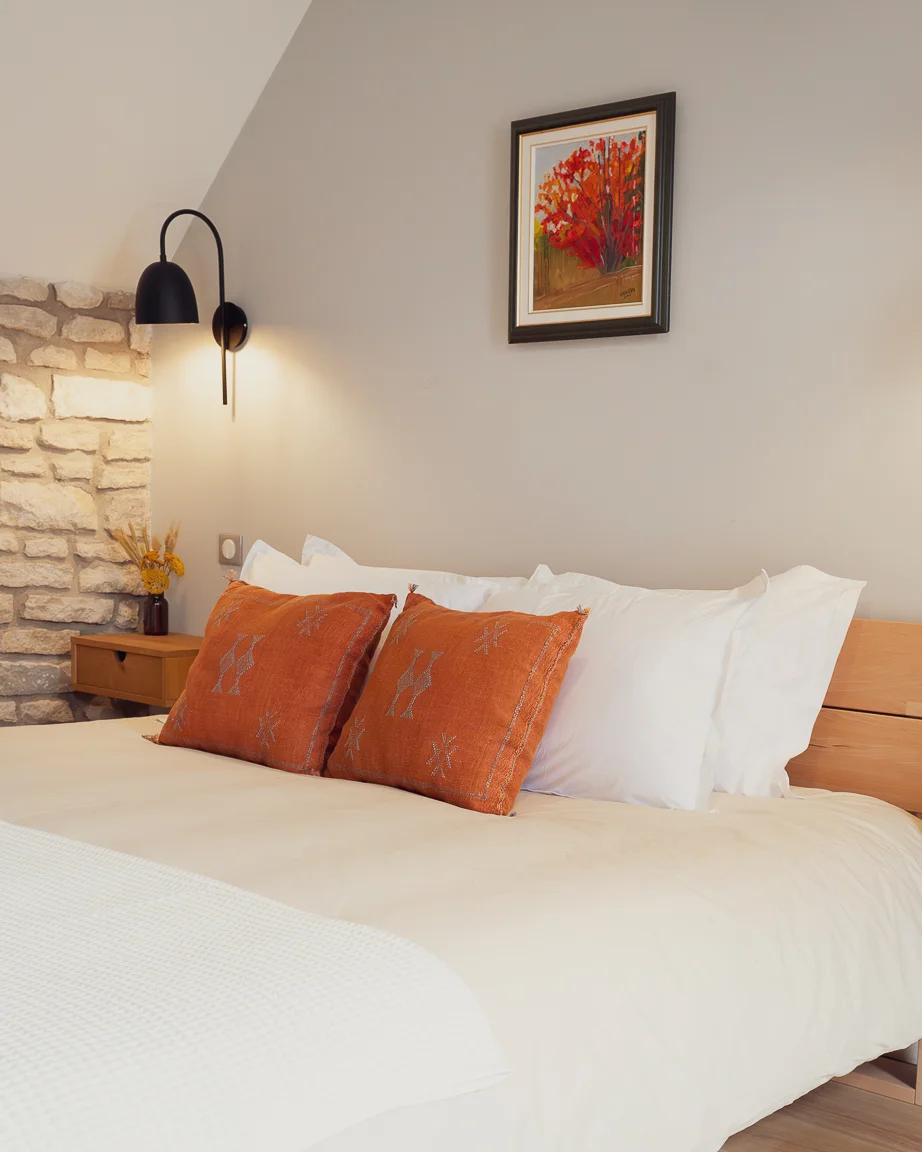 Restored bedroom detail at Maisons Vaudésir